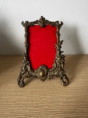 Ornate Brass-Style Decorative Frame with Red Velvet Mat